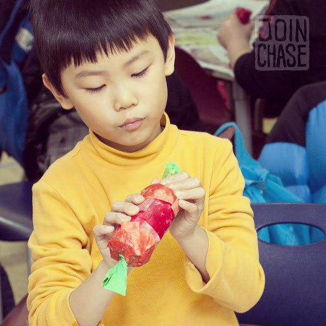 An elementary student making a Paper-mache Party Popper in Ochang, South Korea.