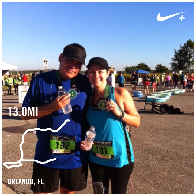 Adam & Mellissa showing off their medals at the Lake Nona Half