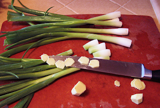 Cutting Board and Knife with Sliced Ginger and Scallions