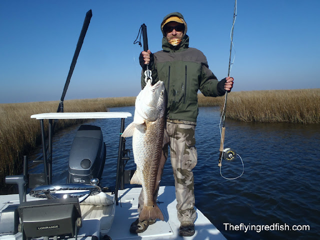 Redfisherman with Large Louisisna Redfish Redfishing around New Orleans