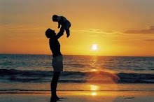 Father and child at sunset