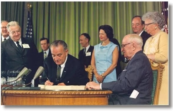 LBJ signs Medicare into Law