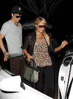 River Viiperi holding the car door for Paris Hilton like a true gentleman