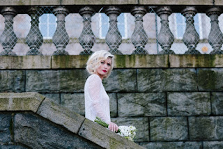 Blonde girl Vintage style shoot with blonde model in a vintage wedding dress with finger waves and red lipstick