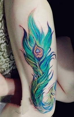 peacock feather tattoo on the leg