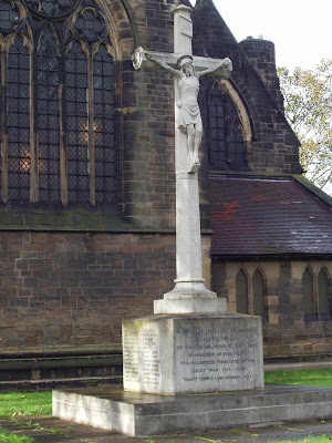 Carlton War Memorial is a Portland stone Calvary Cross on a stone block.  The names are inscised on the four sides of the block