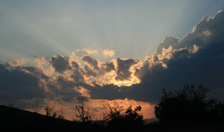 Light-beams shooting between cloud gaps Light-beams shooting between cloud gaps