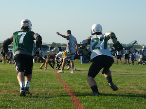 Dawson playing summer lacrosse. He is on the right #27.