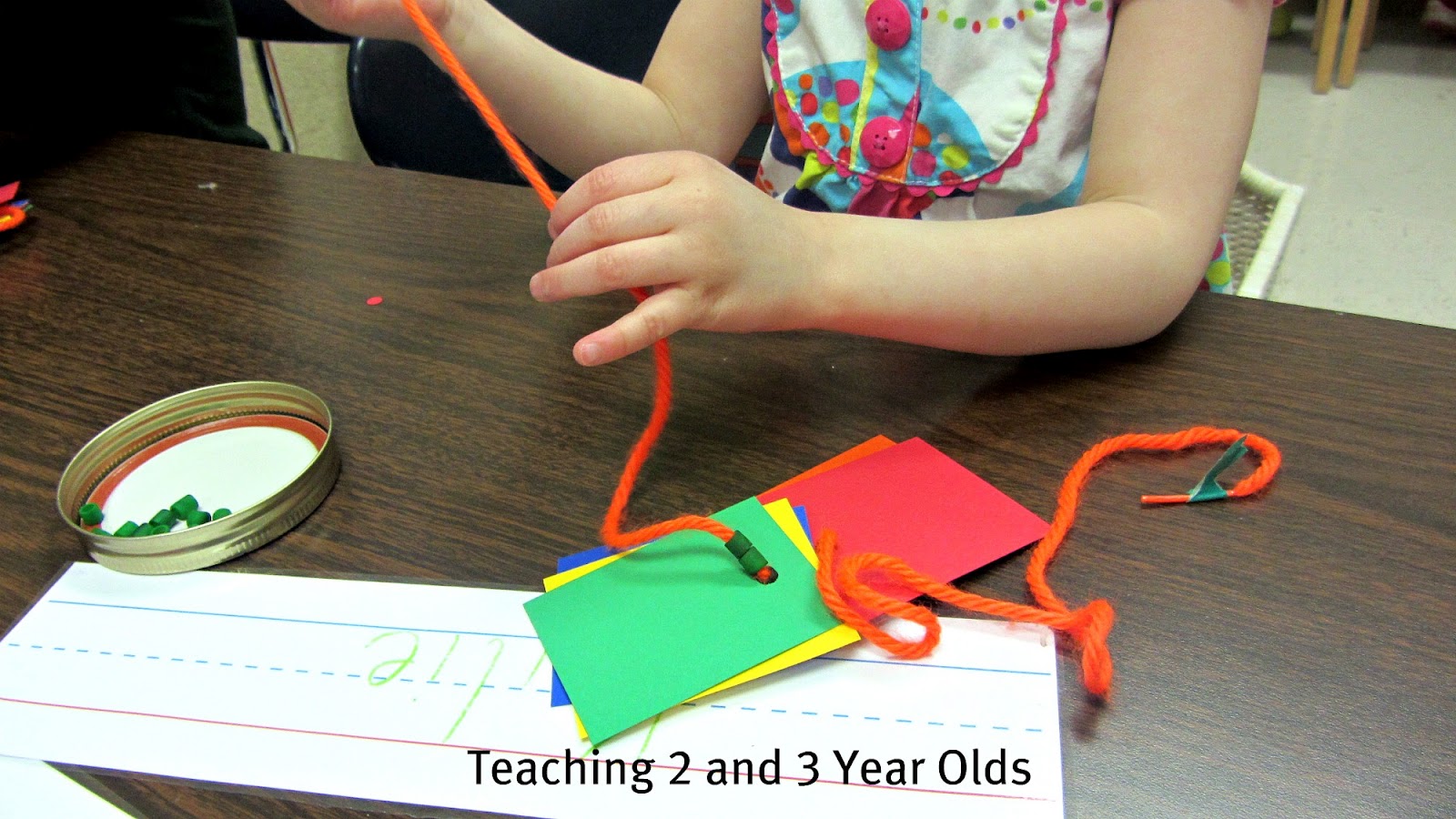 Teaching 2 and 3 Year Olds Rainbow Threading Necklaces