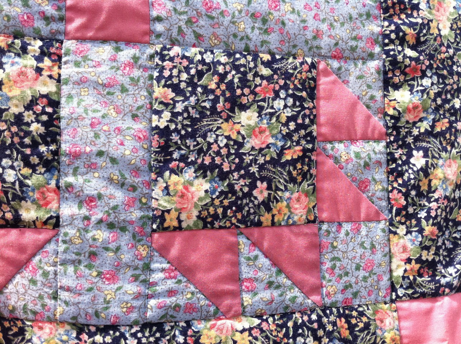 Robin Red Shop Pretty vintage hand sewn quilt in mixed floral fabrics!