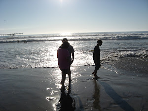 Daniel,Michael and Ariel wading in the ocean.
