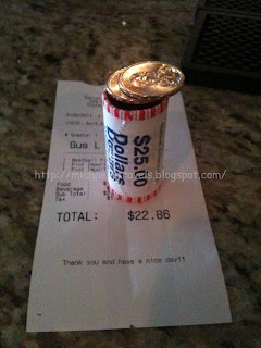 a roll of coins on a receipt