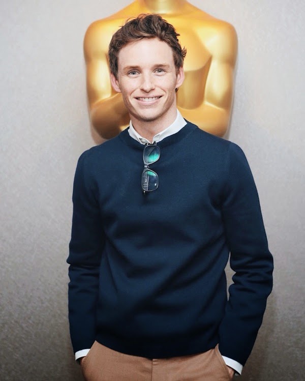 Eddie Redmayne wears Gucci Fall Winter 2014 navy knitwear and beige trousers to 'The Theory of Everything' Screening in NYC 21 October 2014