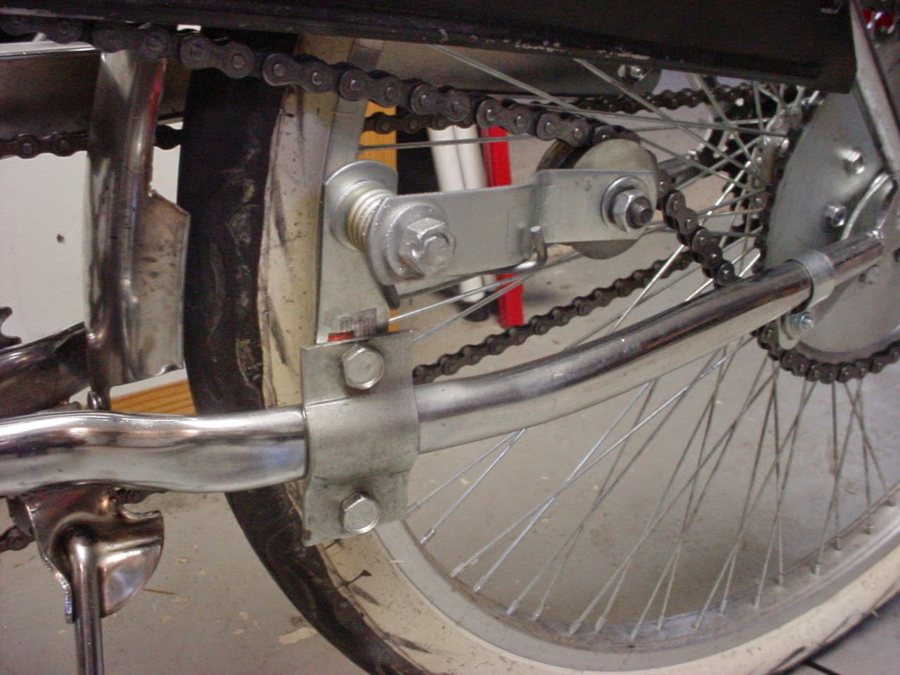 Motored Bicycle Hacks Springloaded tensioner for 3
