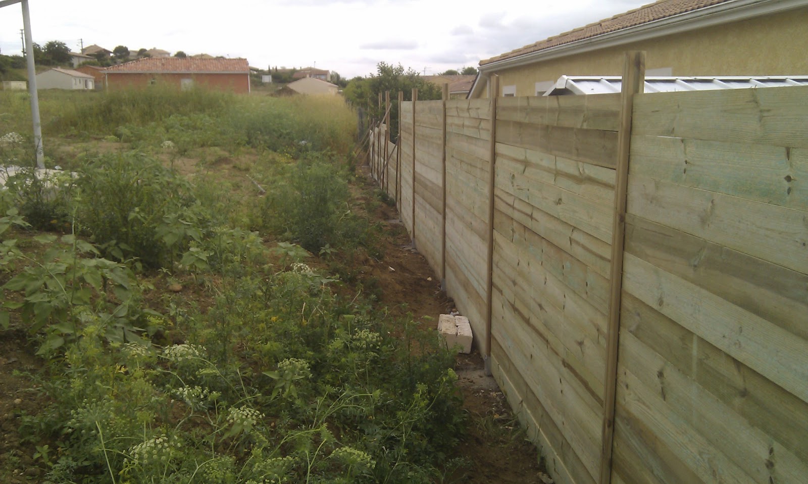 cloture bois terrain en pente