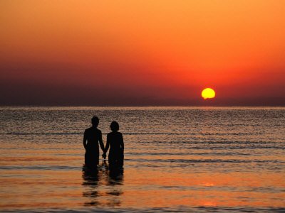 2 People Holding Hands At The Beach. people holding hands around