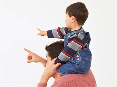 namc montessori encourages toddler independent play child on shoulders pointing