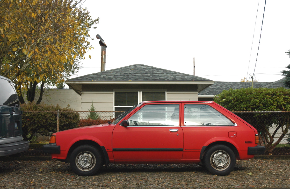 OLD PARKED CARS. 1985 Mazda GLC.