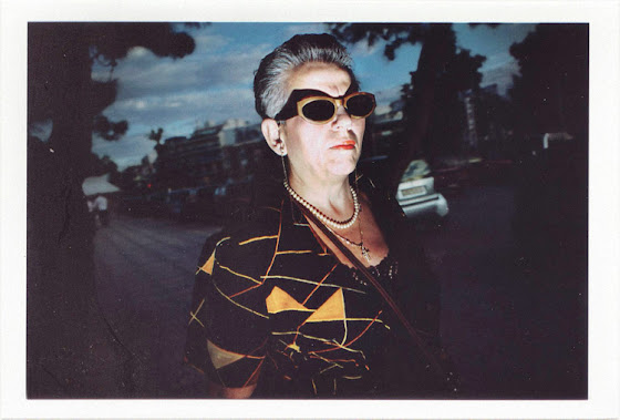 dirty photos - Once - street photo of woman and shadow of sunglasses from flash