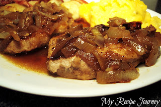 Smothered Pork Chops with Onions and Cheddar Grits
