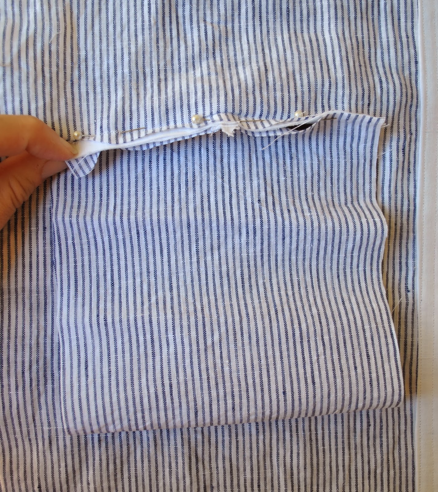 Double welt pocket with looped button closure Handmade by Carolyn