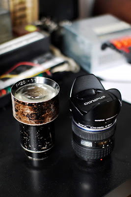 Ł.Z.K. Polkinar 120/1.8 compared to Olympus ZD 12-60/2.8-4.0