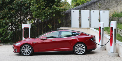 How did Tesla make some of its cars travel further during Hurricane Irma?