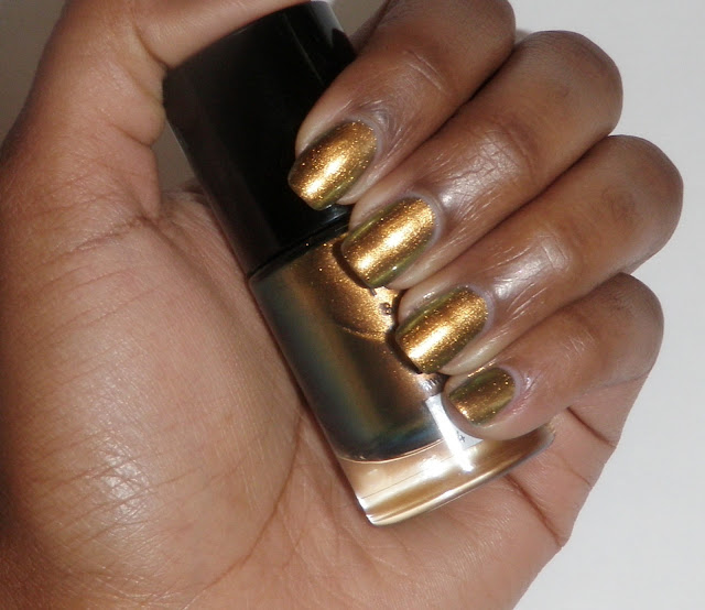 Review and swatches nail polish by Catrice Genius In The Bottle gold.