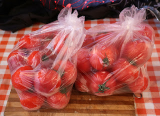A pile of tomatoes to process A pile of tomatoes to process