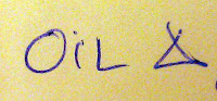handwritten note for 'Oil Change' where change is represented by the delta symbol
