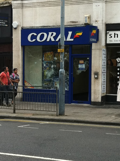 a group of people standing outside a store