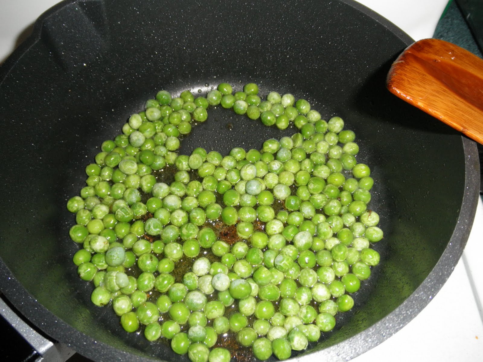 Haitian Creole Making Rice with Peas and Spinach