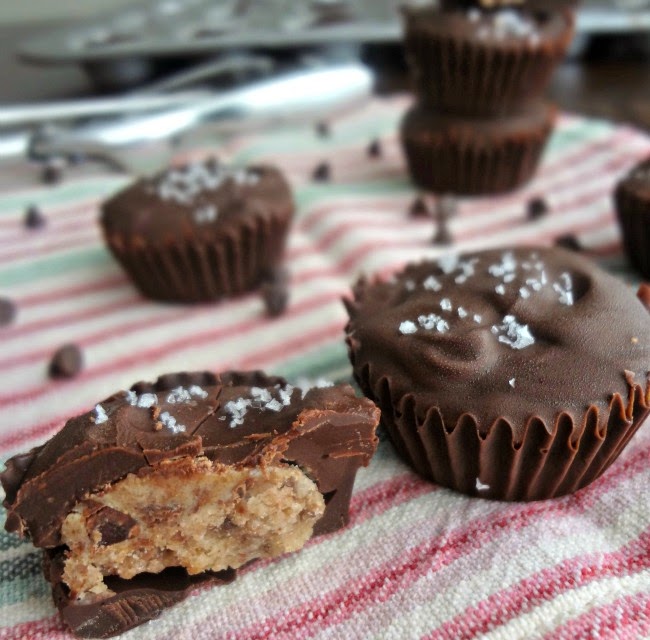 brown butter peanut butter cookie dough cups sitting on pink dishtowel