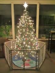 muddling through mayhem christmas traditions 3 gifts baby proofing christmas tree