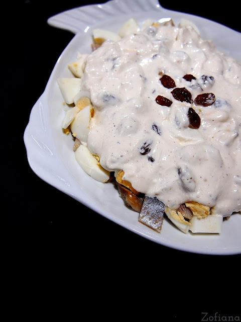 Herring salad with eggs, raisins and horseradish sause