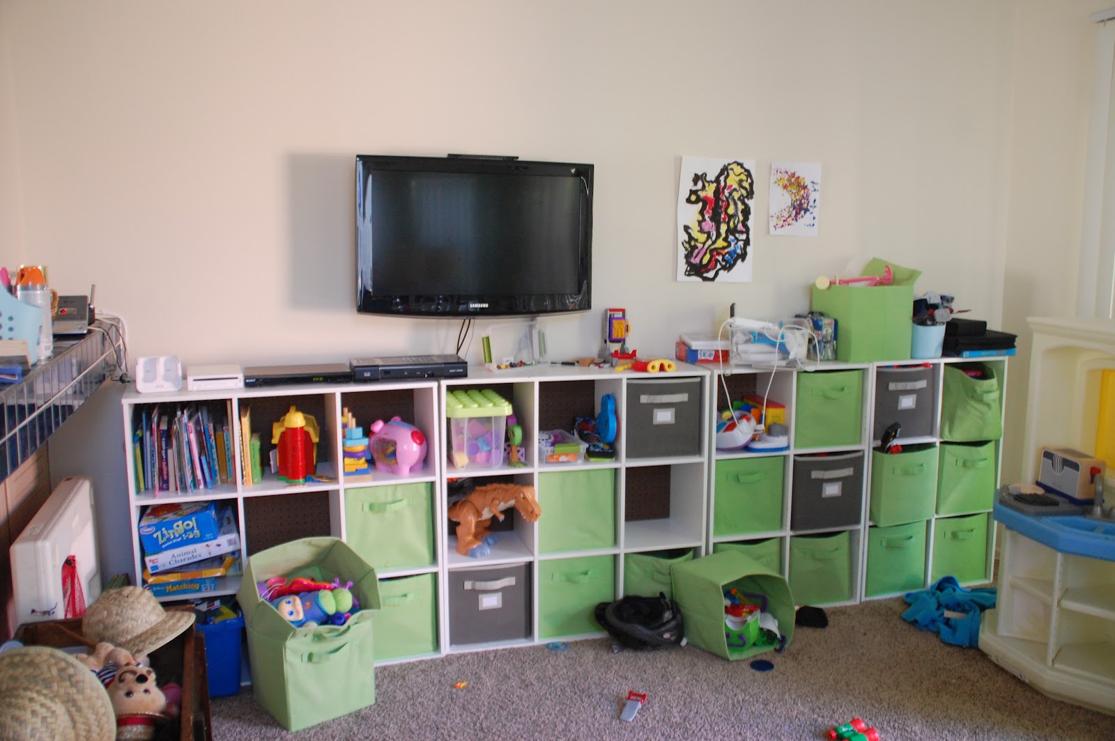 Lisa Moves gallery wall around the playroom tv