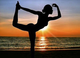 Bikram yoga pose on the beach