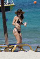 Maria Menounos shows off her body in a string bikini