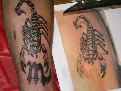 Scorpio tattoos are often dark, mysterious and sensual; rightly so, as these are some of the major personality traits of the eighth sign of the zodiac.  The two most popular designs are the glyph — which looks much like an ‘M’ with an elongated and pointed right side, thus signifying the legs and venomous tail of the scorpion. Or the literal translation of a dark and angry looking scorpion, ready to strike at any moment.