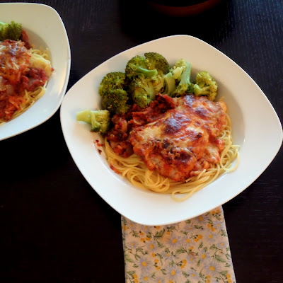 Chicken Parmesan:  Breaded chicken in a tomato sauce smothered in Parmesan and mozzarella cheeses.