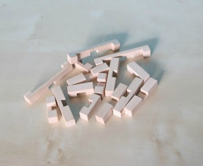 Morgan's Milieu | How Do You Train Your Brain?: A pile of wooden pieces from a wooden puzzle