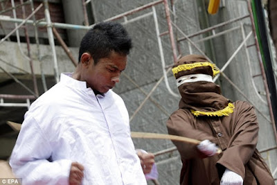 Public caning for committing immoral acts in Aceh, Indonesia