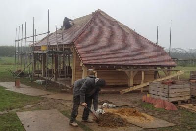 Orchard Priory's team tiling a car barn roof