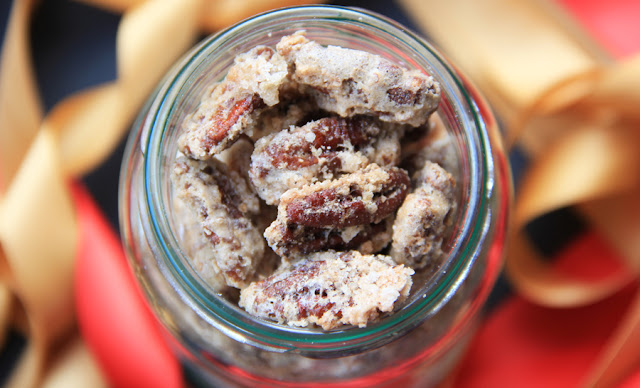 Candied pecans inside a jar. The view is from the top of the jar, looking inside.