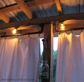 How to make a galvanized curtain rod from plumbing parts. String lights for the patio and drop cloth curtains.