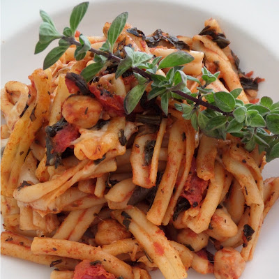 Spinach Pasta Bake:  A vegetarian one dish meal of pasta and tomato sauce, with spinach and garbanzo beans, baked with mozzarella.