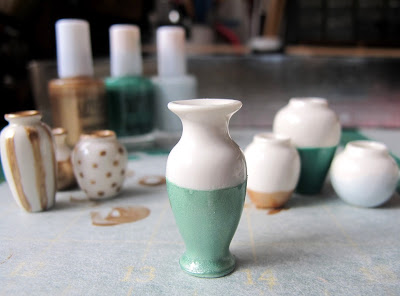 White dolls' house vase, dipped with aqua paint.