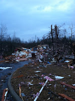 debris-strewn road after tornado in Trussville, Alabama
