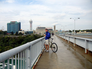 Crossing the Rainbow Bridge from America to Canada with our bikes while visiting the Niagara Falls