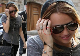 miley cyrus tattoo 2011. miley cyrus tattoo ear. miley cyrus tattoo 2011.